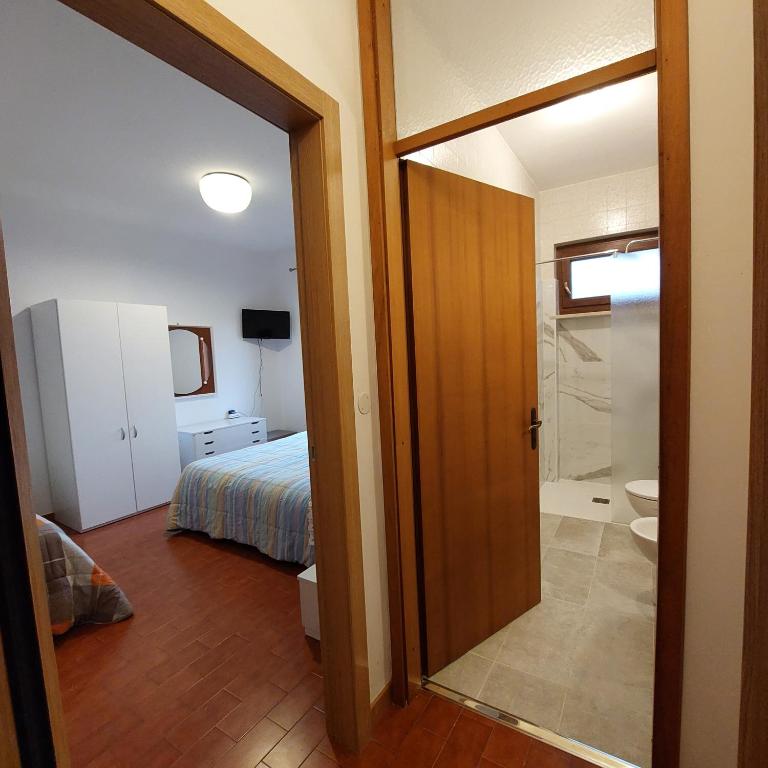 Postel nebo postele na pokoji v ubytování B&B Cuei di Baret