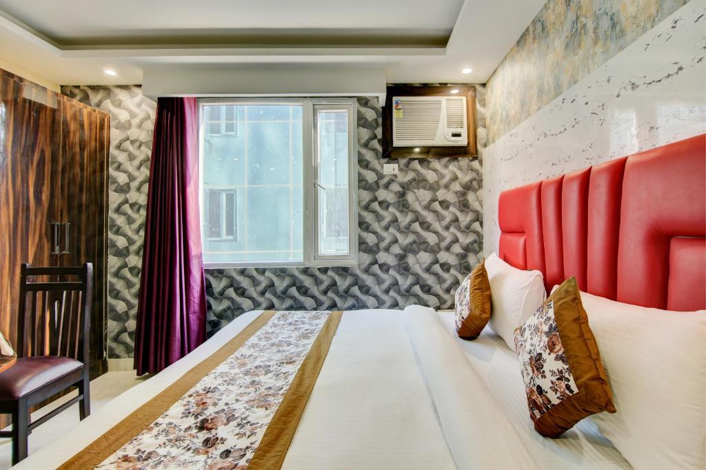 Postel nebo postele na pokoji v ubytování Smart Plaza Hotel