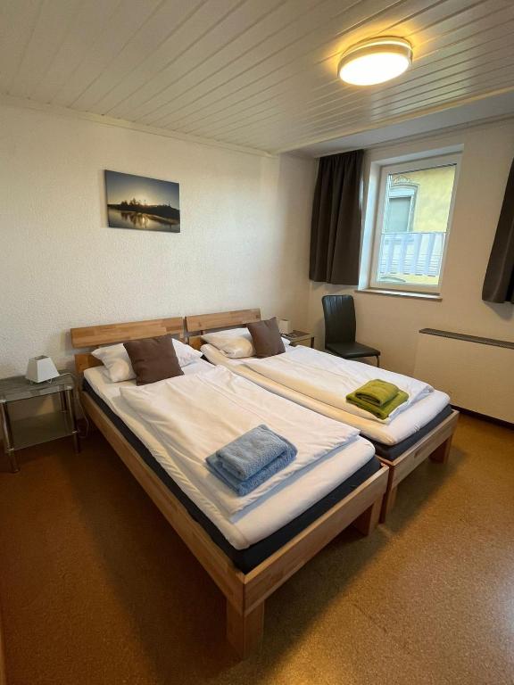 Postel nebo postele na pokoji v ubytování Pension Maintal Eltmann