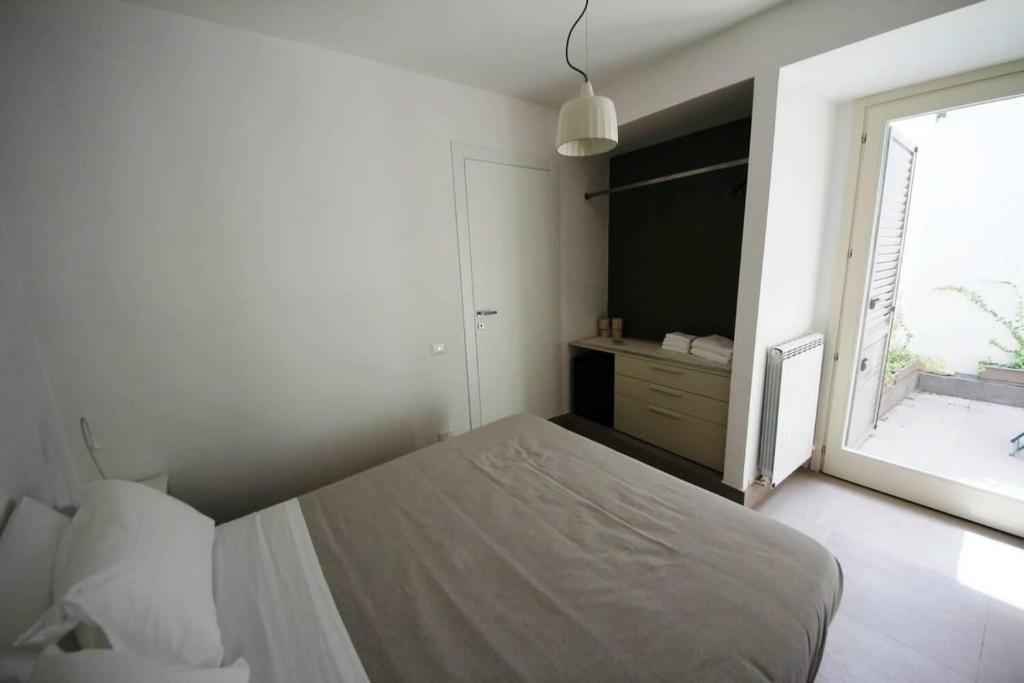 Postel nebo postele na pokoji v ubytování RAL 7039