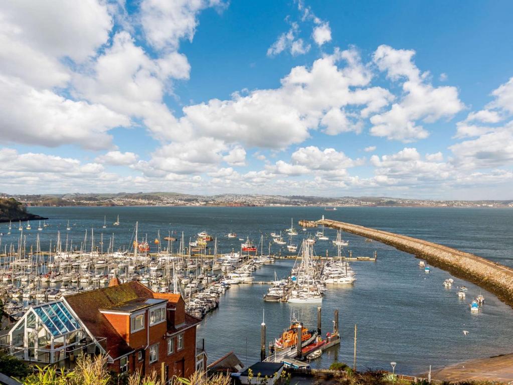 a harbor filled with lots of boats in the water at 3 bed property in Brixham BX034 in Brixham