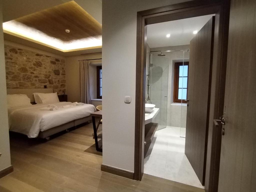 Postel nebo postele na pokoji v ubytování Μikri Arktos Boutique Hotel