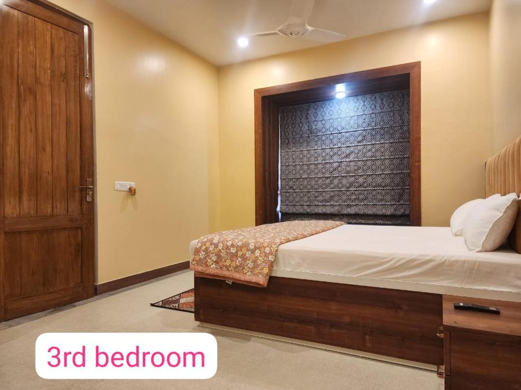 a bedroom with a bed with a bedroom at Richak Ganges villa in Kolkata