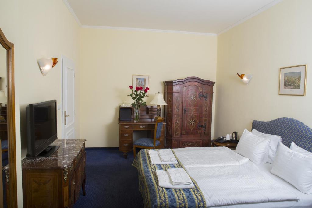 Postel nebo postele na pokoji v ubytování Hotel Tyl