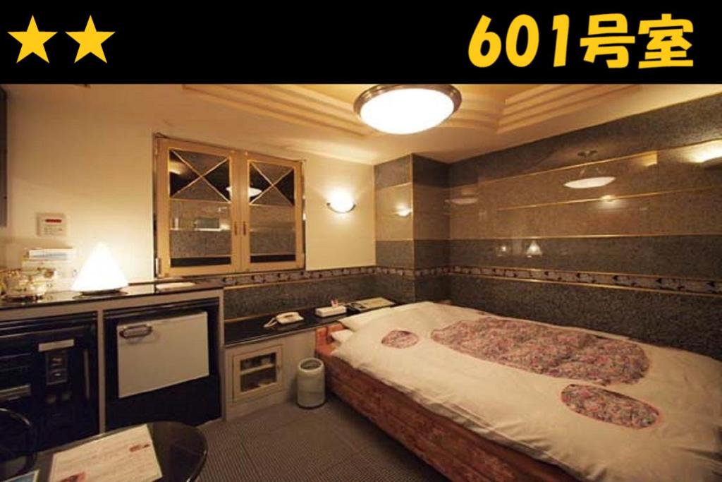 Postel nebo postele na pokoji v ubytování HOTEL Us Racecourse Adult only