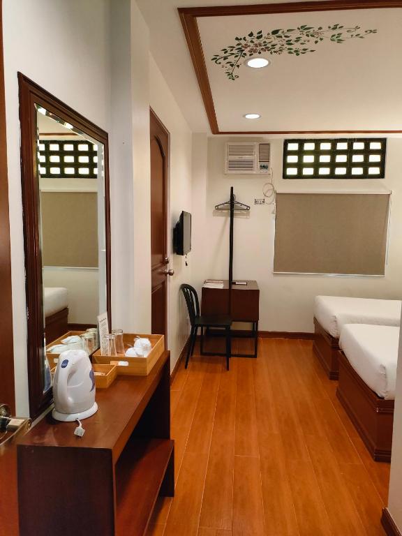 Postel nebo postele na pokoji v ubytování LaVie Hotel
