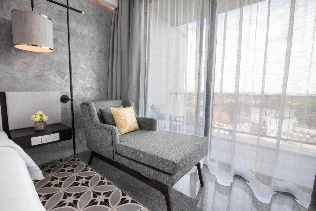 Postel nebo postele na pokoji v ubytování Hotel Vellita Siem reap