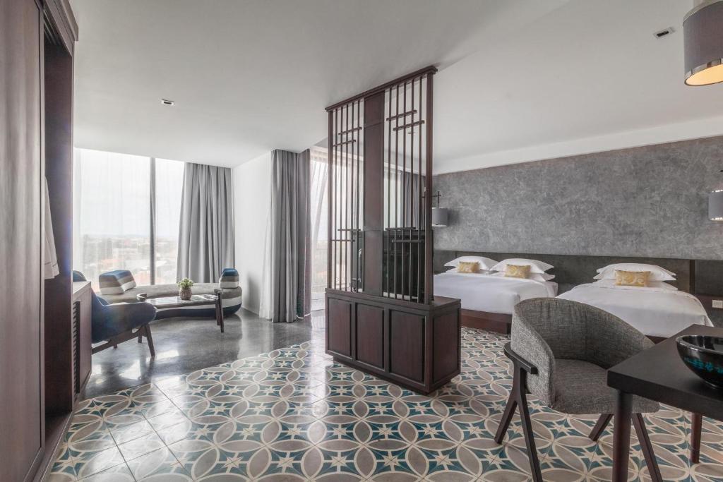 Postel nebo postele na pokoji v ubytování Hotel Vellita Siem reap