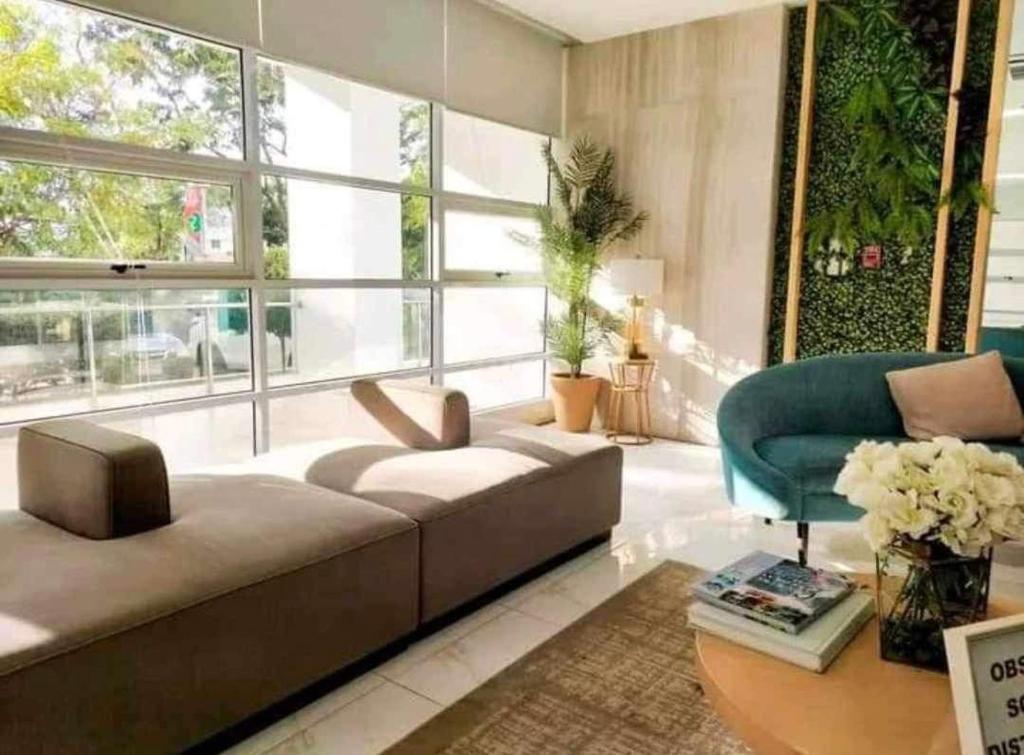 a living room with a couch and a chair at Studio with Balcony at The Loop Tower in Cagayan de Oro