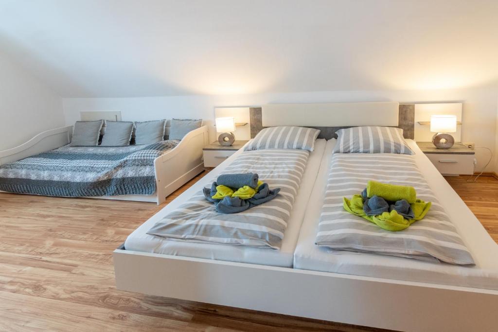 Postel nebo postele na pokoji v ubytování Ferienhaus Heimatdock