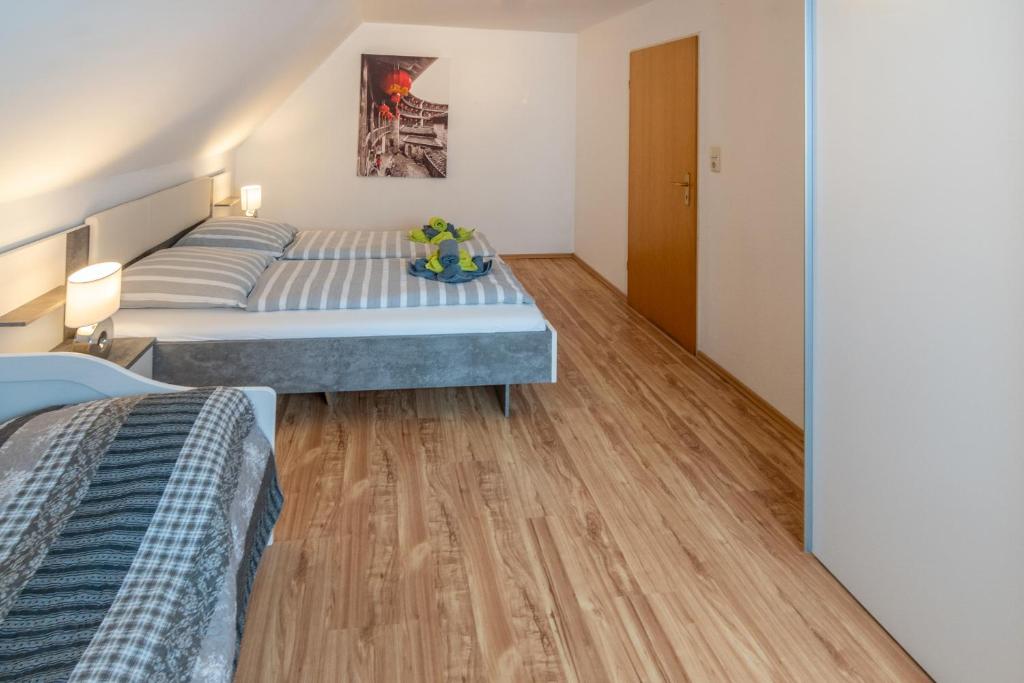 Postel nebo postele na pokoji v ubytování Ferienhaus Heimatdock