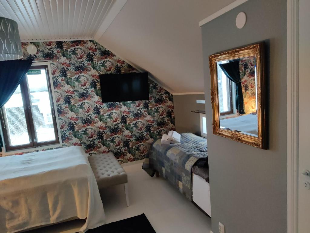 Guesthouse Lokinlaulu - Habitación Triple Estándar