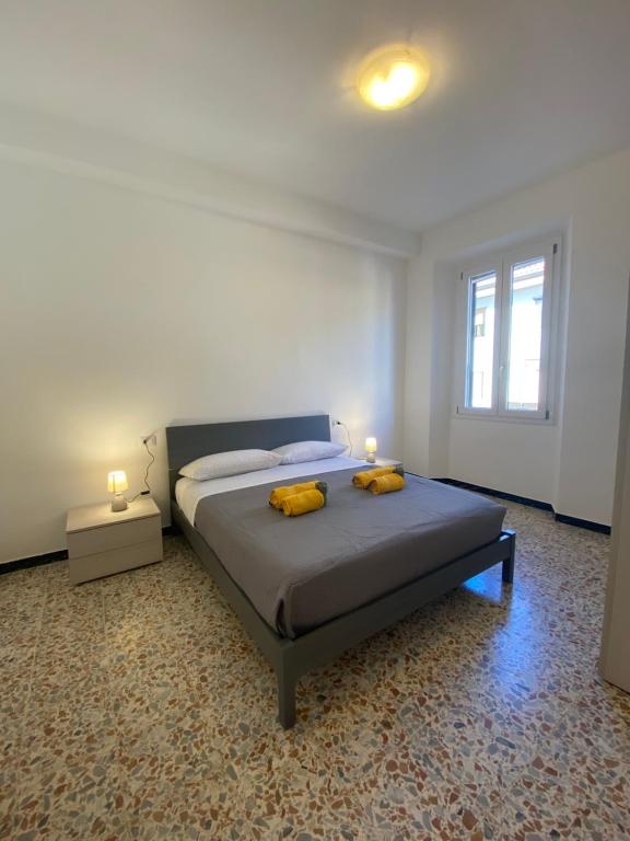 Giường trong phòng chung tại Alghero Darsena Apartment