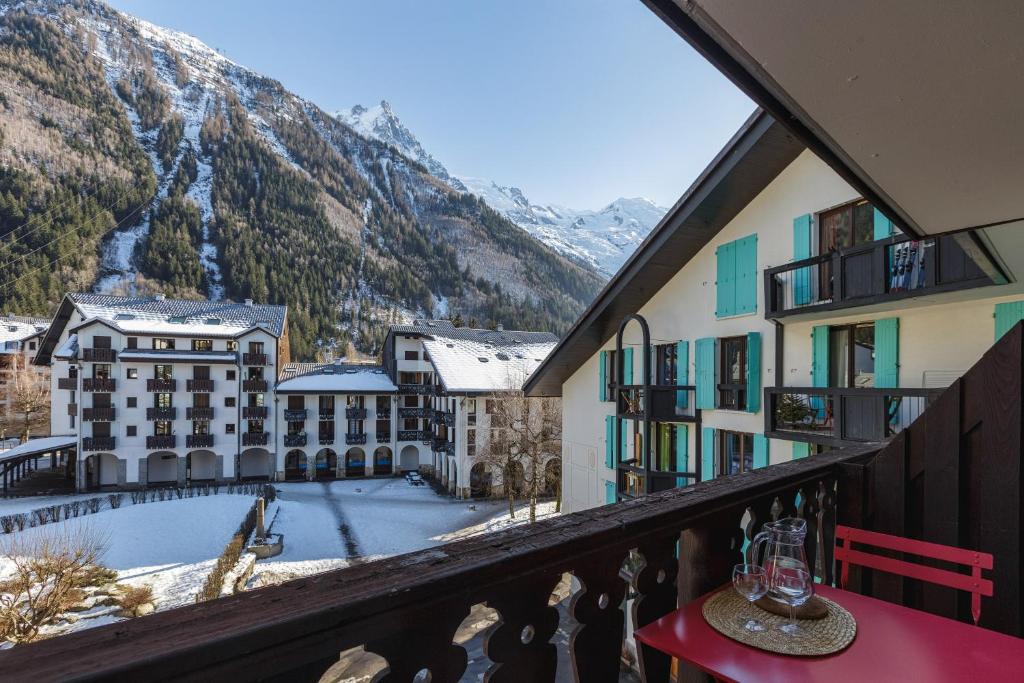 a balcony with a table and a view of a mountain at Chamonix Sud - Forclaz 304 - Happy Rentals in Chamonix