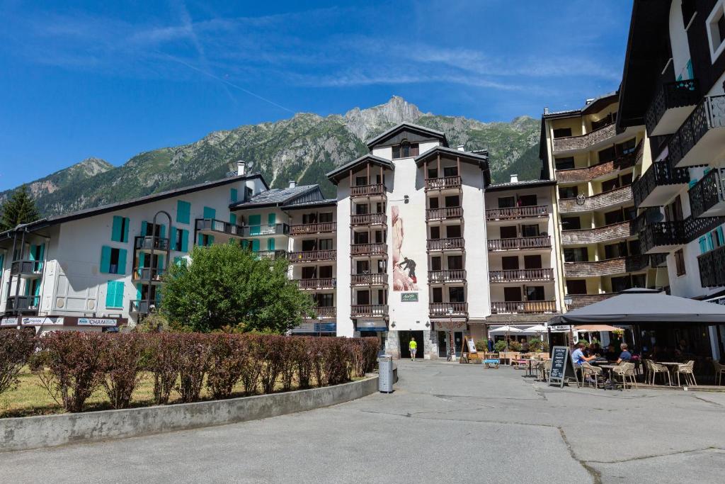 a group of buildings with mountains in the background at Chamonix Sud - Forclaz 304 - Happy Rentals in Chamonix