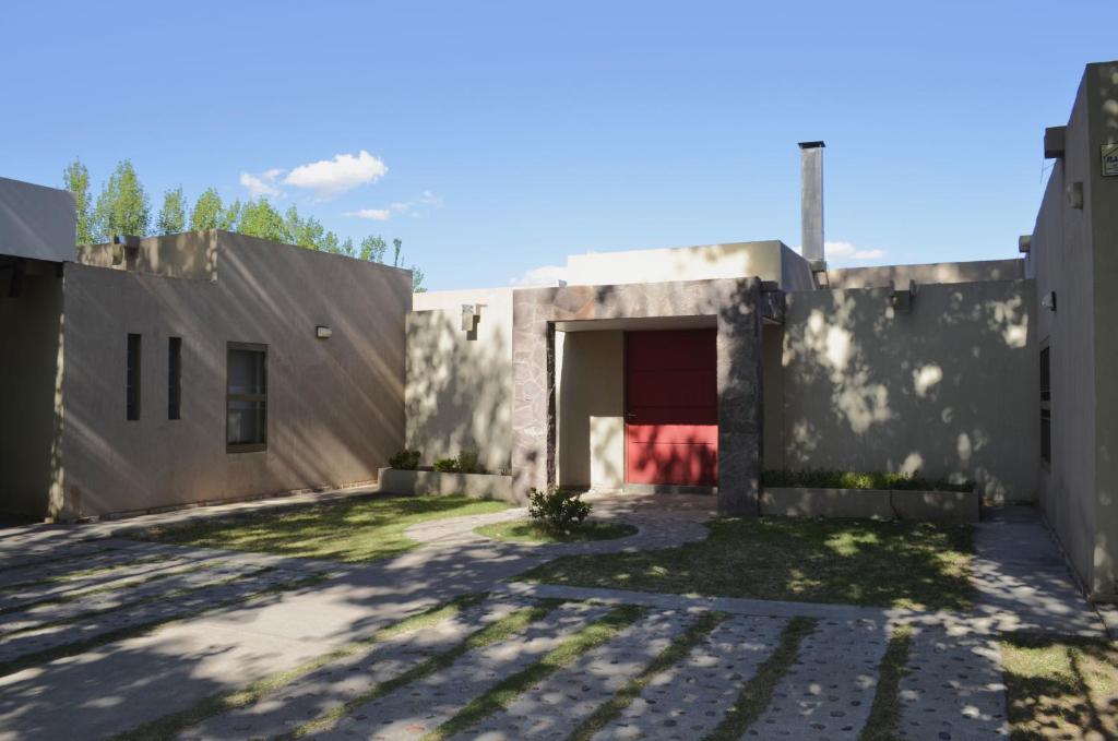 a rendering of a building with a garage at Casa con gran parque y pileta in General Alvear