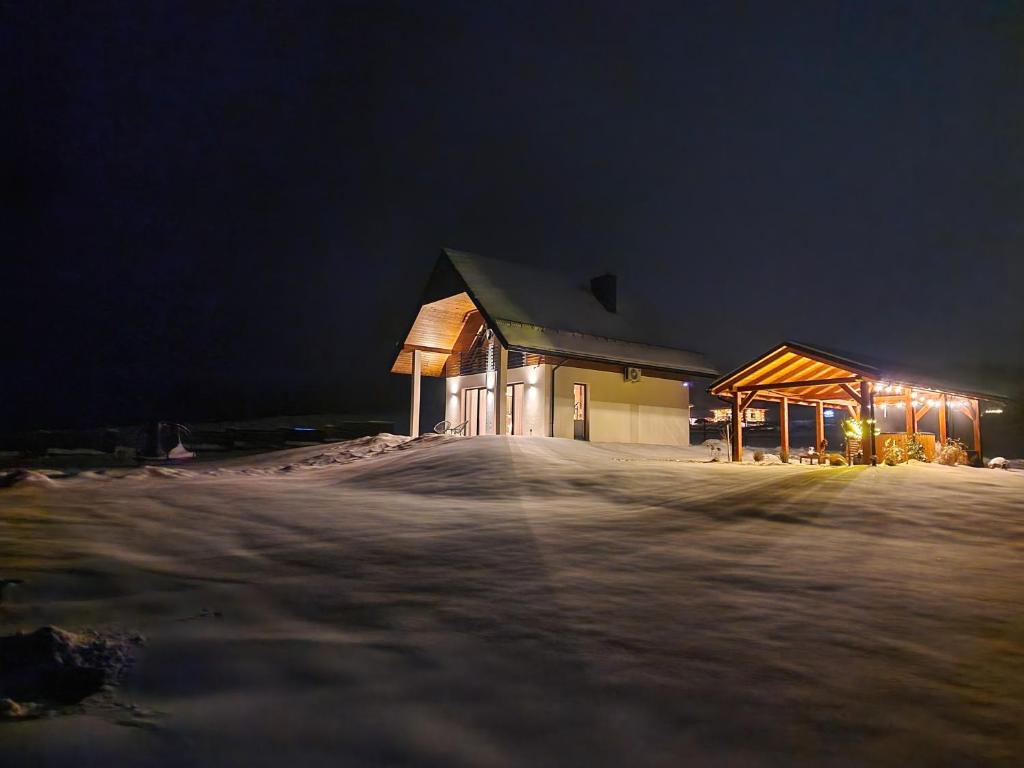 a large building at night with lights on at Lackowa Chill and Rest dom z balią in Uście Gorlickie