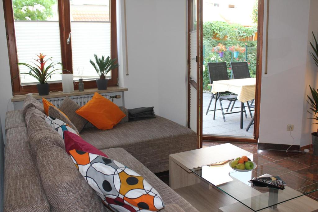 a living room with a couch and a table at Ferienwohnung Novotny in Lörrach