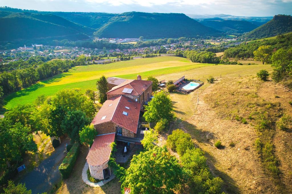 an aerial view of a house on a hill at la Ferme de Vazerat in Massiac