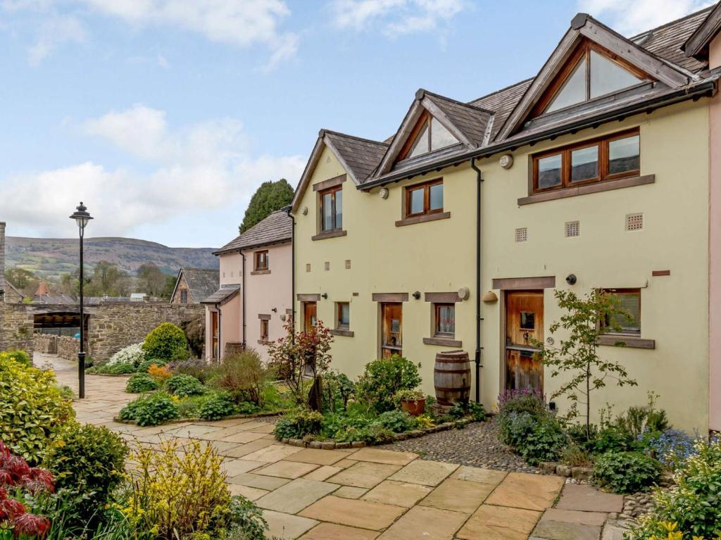 an exterior view of a house with a garden at 1 bed in Crickhowell 82777 in Crickhowell