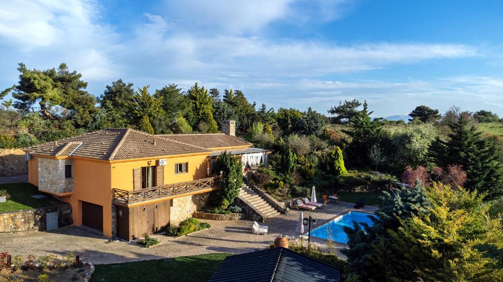 an aerial view of a house with a swimming pool at Maison Christine Villa in Varnávas