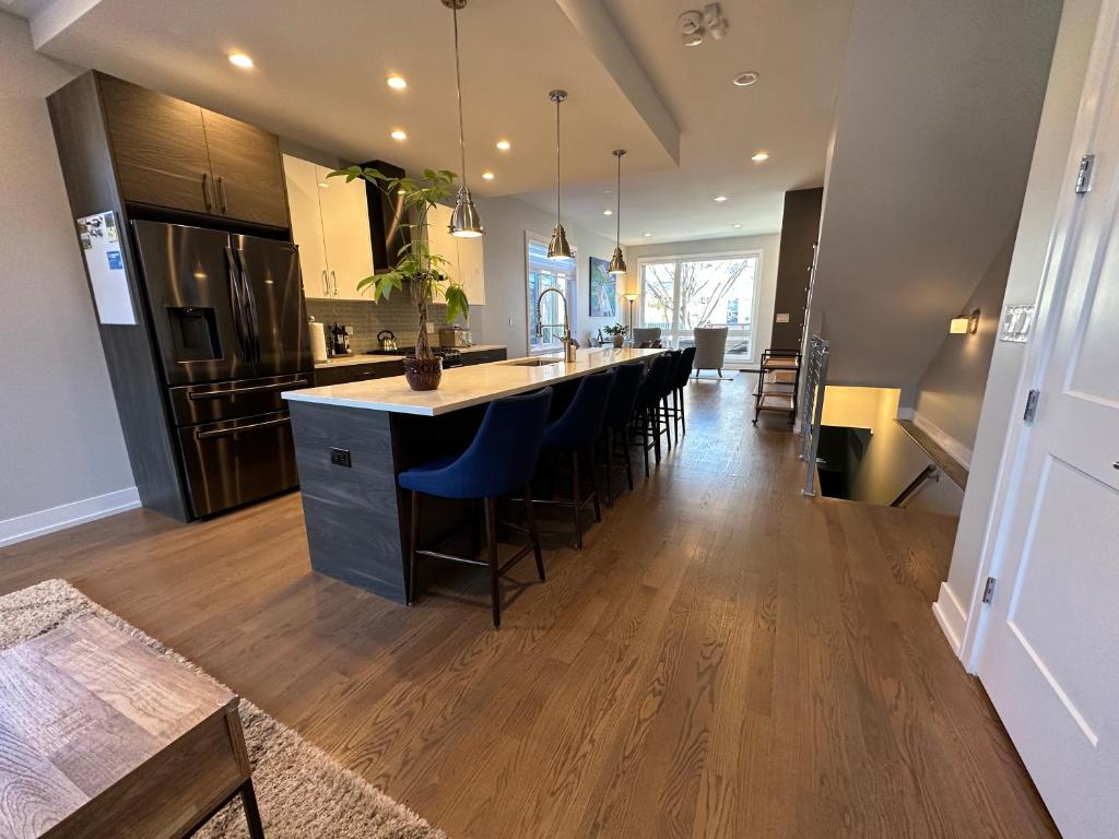 a kitchen with a large island in the middle at Modern SFH Near McCormick Place & Soldier Field in Chicago