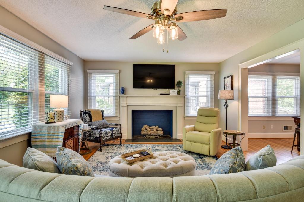 a living room with a couch and a fireplace at Lincolnton Vacation Rental with Deck and Yard! in Lincolnton
