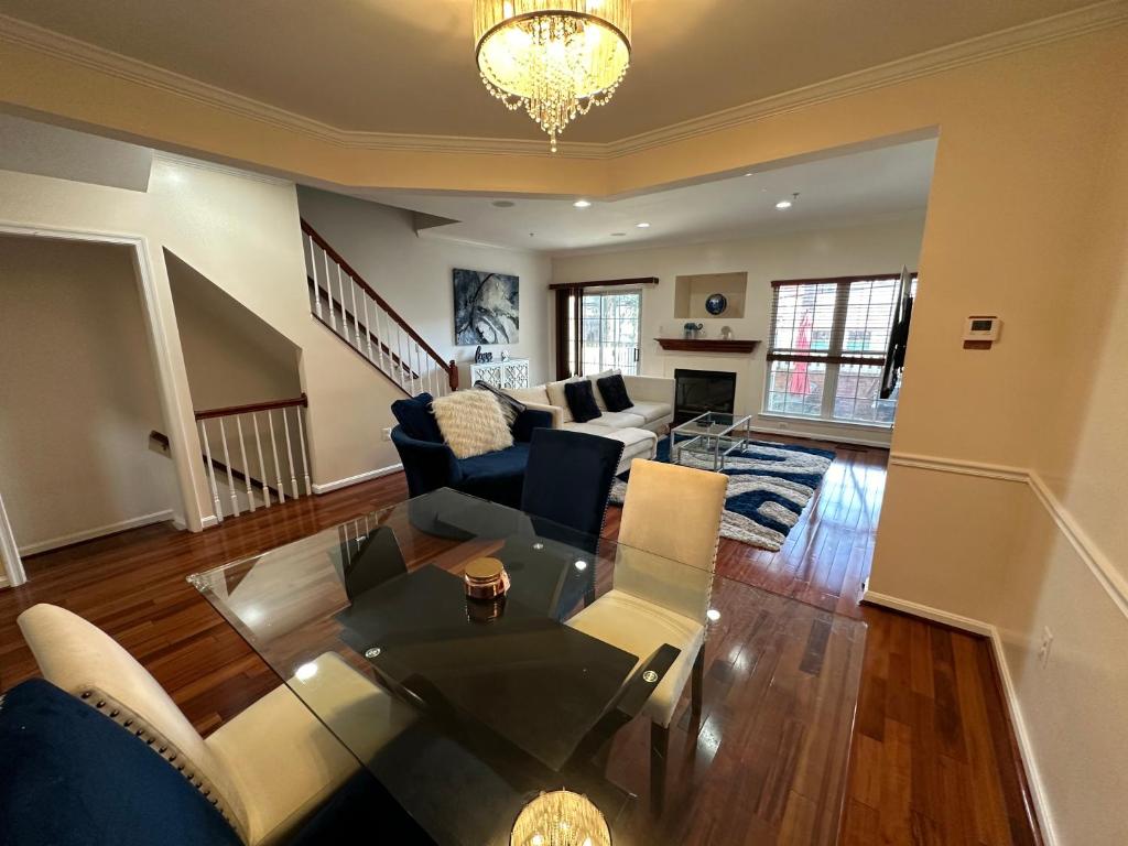 a living room with a couch and a table at Beautiful & Luxurious 2 bed 2 & half bth & 2 car attached garage TownHouse in Falls Church in Falls Church