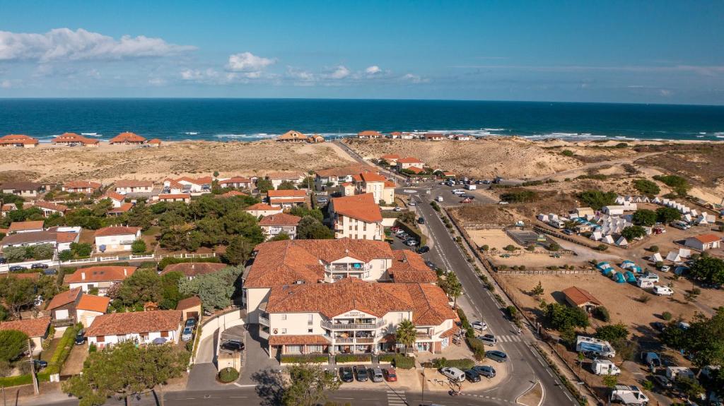 an aerial view of a residential suburb with the ocean at Sables d'Or in Vieux-Boucau-les-Bains