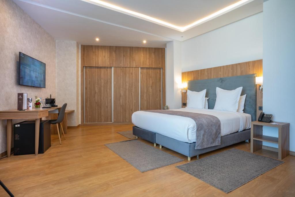 Postel nebo postele na pokoji v ubytování Dominium Hotel
