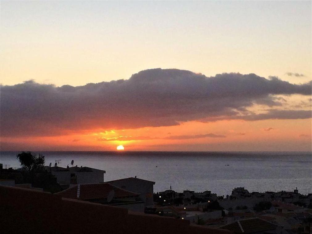 a sunset over the ocean with the sun in the sky at Ocean View 1 bedroom in Costa Adeje in Adeje