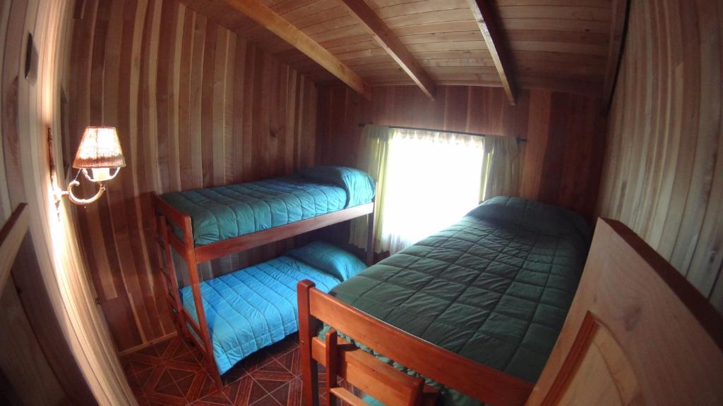 Двухъярусная кровать или двухъярусные кровати в номере Los arrayanes de huife