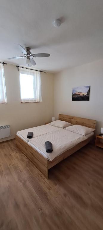 Postel nebo postele na pokoji v ubytování U Ječmínka