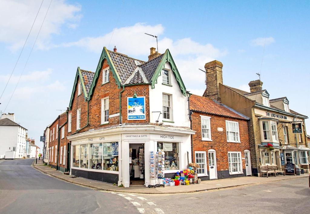 a building on the corner of a street at 3 Trinity Street in Southwold