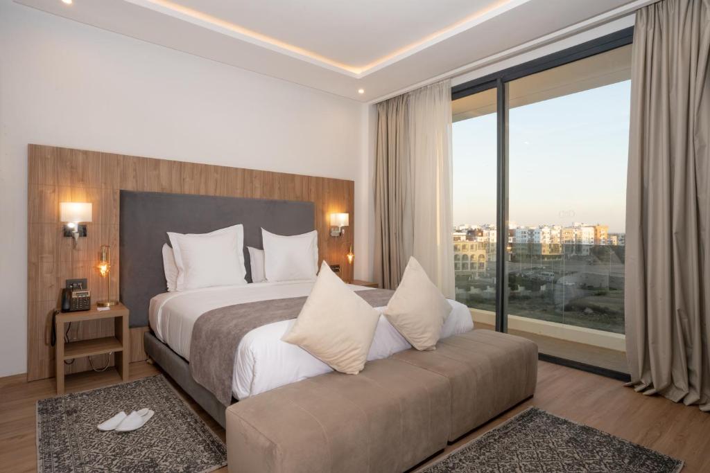 Postel nebo postele na pokoji v ubytování Dominium Hotel
