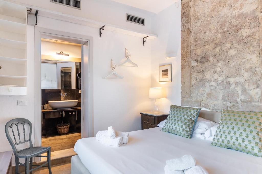 Кровать или кровати в номере Masseria Costanza Vendicari