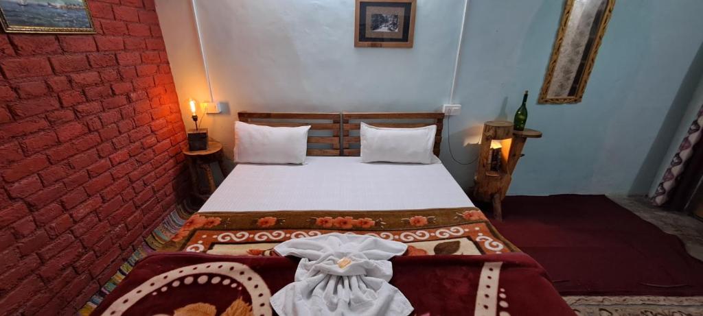Postel nebo postele na pokoji v ubytování Leela Cottages