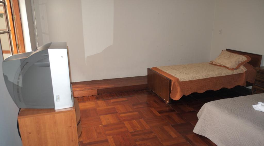 Rúm í herbergi á Inkawasi Miraflores Hostel