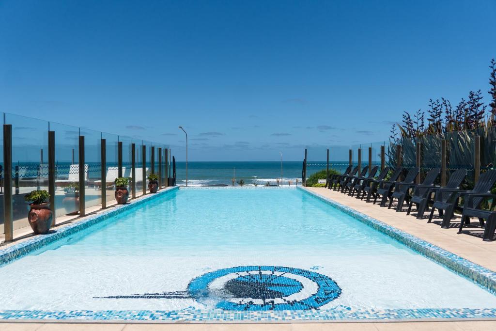 a swimming pool with a turtle design on it at Hotel AATRAC in Mar del Plata