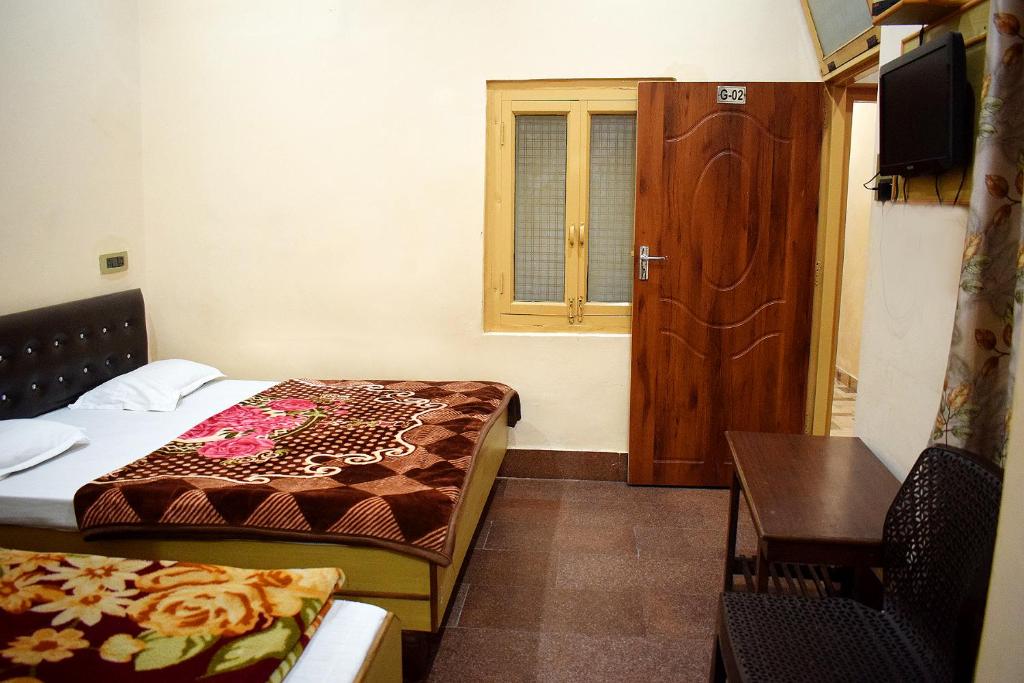 Postel nebo postele na pokoji v ubytování Hotel Golden