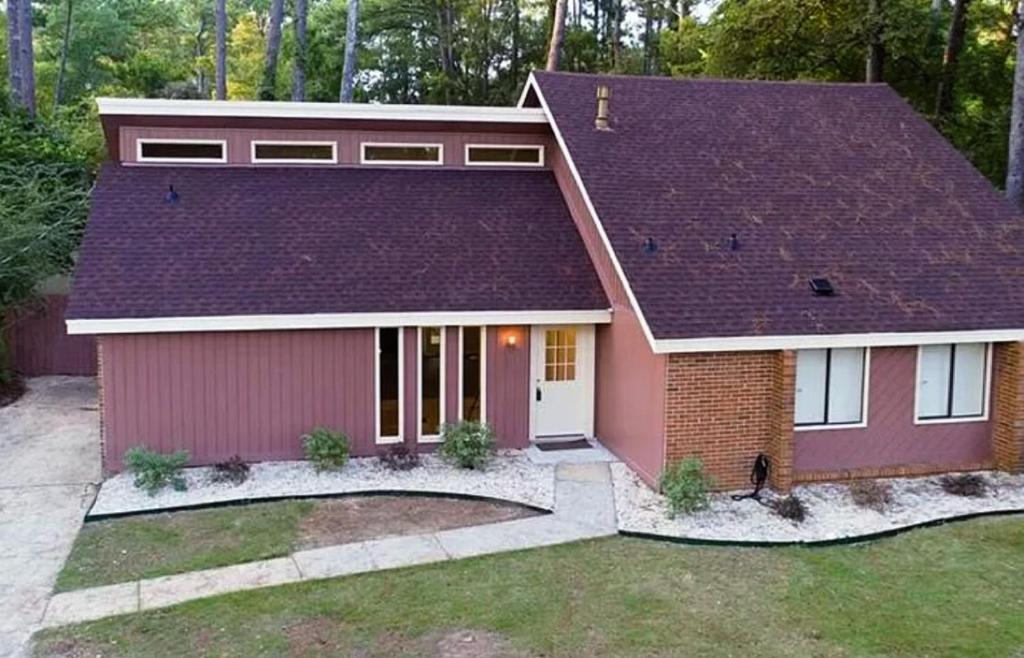 a red house with a purple roof at Quiet and Beautiful home in Montgomery