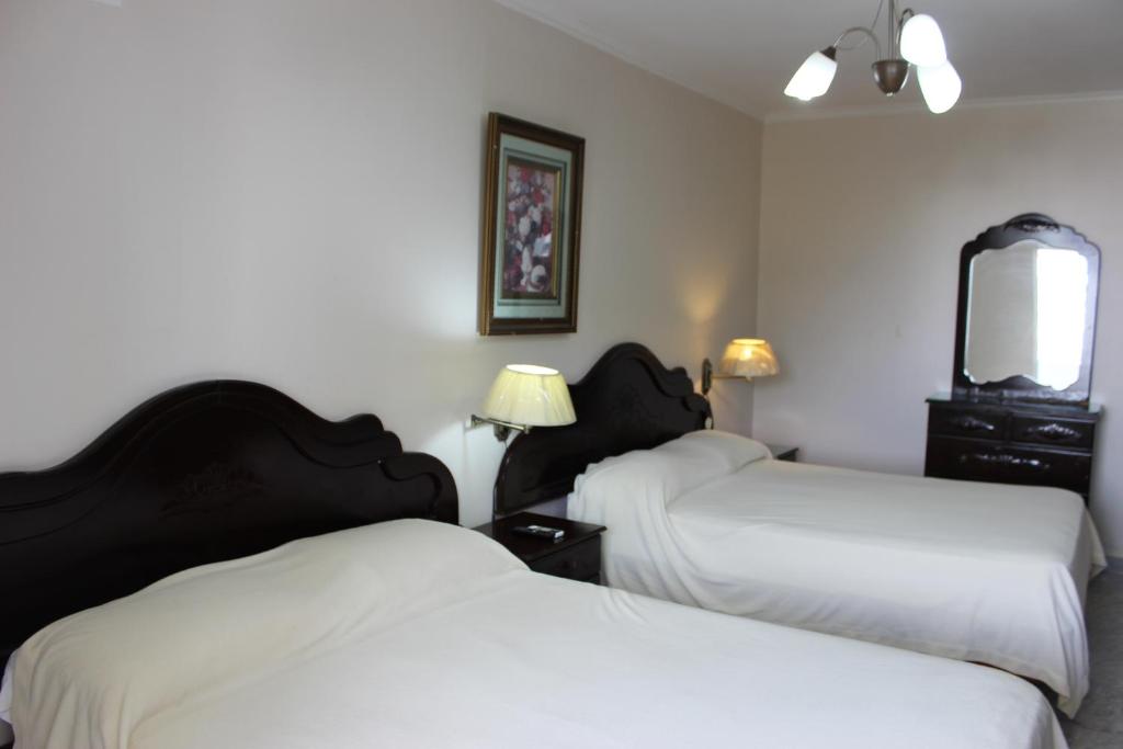Postel nebo postele na pokoji v ubytování Hotel Parador