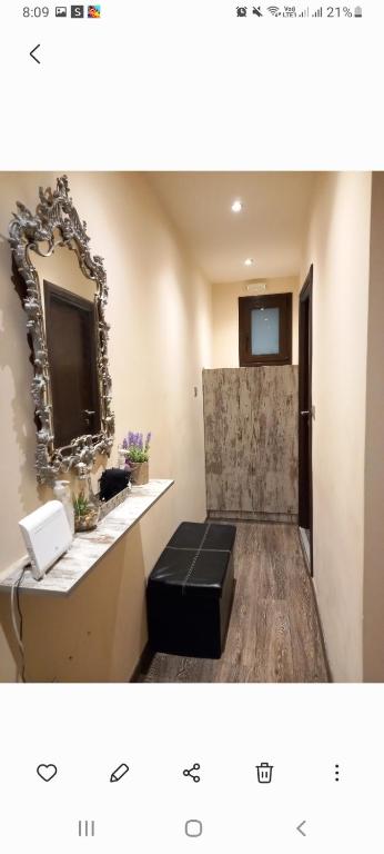 a picture of a bathroom with a mirror and a stool at Lux Studio 3 in Athens