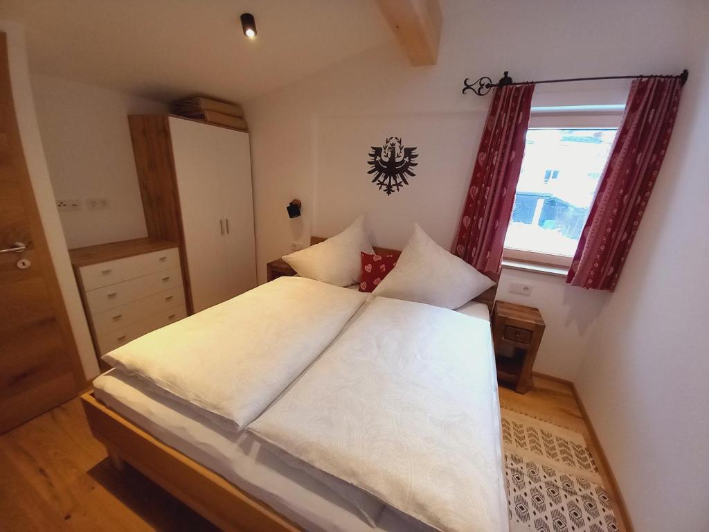 Postel nebo postele na pokoji v ubytování Haus Rosenegg