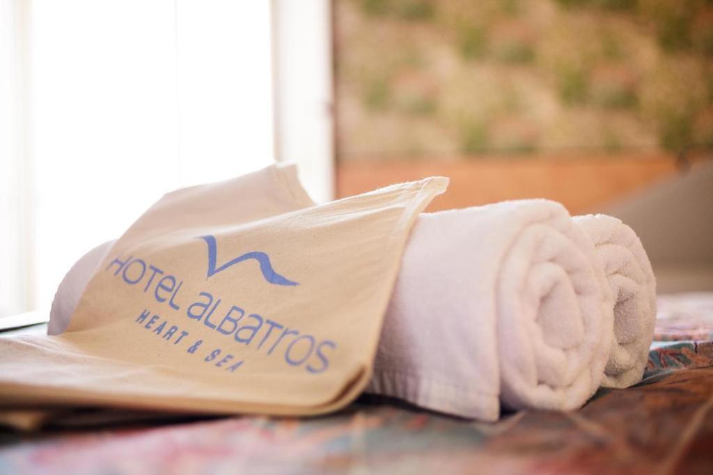 a roll of towels sitting on top of a table at Hotel Albatros in Batumi