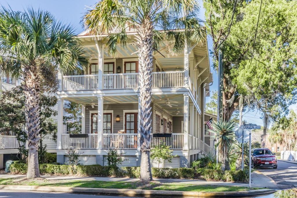 a house with palm trees in front of it at Couples Retreat, Walk to waterfront, shops and restaurants! in Beaufort