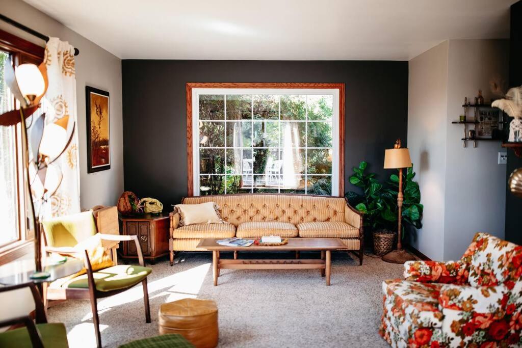 a living room with a couch and a window at That 70s House at Hidden Creek Estates in Roscoe