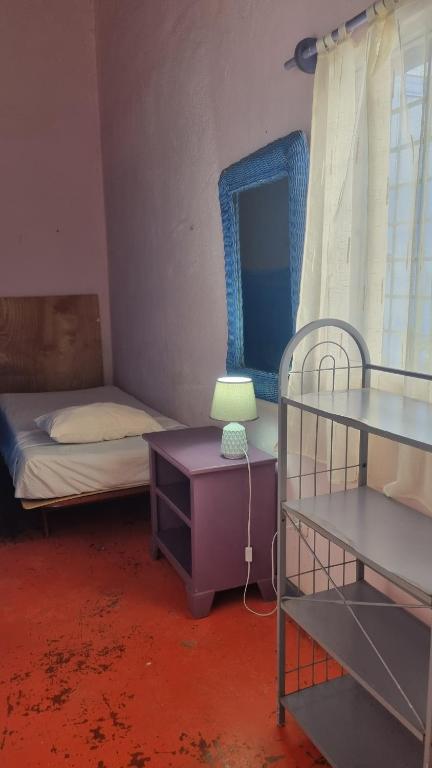Postel nebo postele na pokoji v ubytování Il Triangolo Hostel