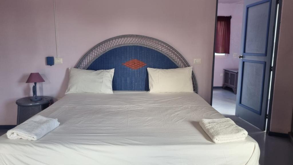 Postel nebo postele na pokoji v ubytování Il Triangolo Hostel