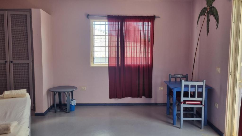 Postel nebo postele na pokoji v ubytování Il Triangolo Hostel